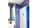 Bathroom shower with purple trim, turquoise tile accent, and clear shower door at 5929 Gentle Creek Ln, North Las Vegas, NV 89031