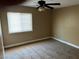 Neutral bedroom featuring window with blinds and neutral carpet at 608 Watkins Dr, Las Vegas, NV 89107