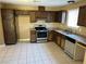 Traditional kitchen with wood cabinets and stainless steel appliances at 608 Watkins Dr, Las Vegas, NV 89107
