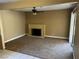 Open-concept living area featuring a brick fireplace and sliding glass door at 608 Watkins Dr, Las Vegas, NV 89107