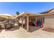 Inviting backyard with covered patio, pool, and outdoor seating at 6307 Dusty Mile Ct, North Las Vegas, NV 89031