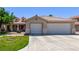 Charming single-story home with a large driveway and a well-manicured lawn in a suburban setting at 6307 Dusty Mile Ct, North Las Vegas, NV 89031