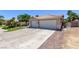 Charming single-story home featuring a two-car garage, well-maintained landscaping, and a beautiful tile roof at 6307 Dusty Mile Ct, North Las Vegas, NV 89031