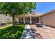 Inviting front porch featuring seating, a small fire pit, and attractive landscaping enhancing the home's curb appeal at 6307 Dusty Mile Ct, North Las Vegas, NV 89031