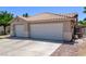 Three car garage and wide driveway at 6307 Dusty Mile Ct, North Las Vegas, NV 89031