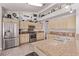 Well-appointed kitchen featuring stainless steel appliances, light wood cabinetry, and granite countertops at 6307 Dusty Mile Ct, North Las Vegas, NV 89031