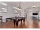 Large game room features a pool table, wood floors, and ample space for entertainment at 6307 Dusty Mile Ct, North Las Vegas, NV 89031