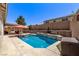 Backyard pool and spa with outdoor kitchen and patio at 6307 Dusty Mile Ct, North Las Vegas, NV 89031