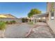 Spacious backyard featuring decorative concrete border, gravel, and shaded pergola at 641 Bay Bridge Dr, North Las Vegas, NV 89032