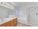 Bright bathroom featuring double sinks, soaking tub, and separate shower at 641 Bay Bridge Dr, North Las Vegas, NV 89032
