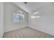 Sunlit bedroom featuring neutral carpet, window, and vaulted ceiling at 641 Bay Bridge Dr, North Las Vegas, NV 89032