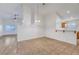 Dining area featuring tile flooring that transitions to the living room's laminate flooring at 641 Bay Bridge Dr, North Las Vegas, NV 89032