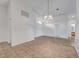 Open dining area with tile flooring and modern lighting, perfect for entertaining guests at 641 Bay Bridge Dr, North Las Vegas, NV 89032