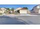 Charming single-story home with desert landscaping and a two-car garage on a sunny day at 641 Bay Bridge Dr, North Las Vegas, NV 89032