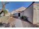 Inviting front exterior with a walkway leading to the front door and desert landscaping at 641 Bay Bridge Dr, North Las Vegas, NV 89032