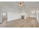 Inviting living room with laminate floors, fireplace, ceiling fan, and vaulted ceilings at 641 Bay Bridge Dr, North Las Vegas, NV 89032