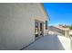 A bright open balcony with a view and double doors to access the inside at 7537 Splashing Rock Dr, Las Vegas, NV 89131