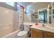 Full bathroom with tub, shower, and light wood vanity at 7537 Splashing Rock Dr, Las Vegas, NV 89131