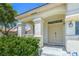 Inviting front porch with stone pillars and a well-maintained garden at 7537 Splashing Rock Dr, Las Vegas, NV 89131