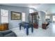 Spacious game room with a foosball table and a display cabinet is perfect for entertaining and relaxation at 7537 Splashing Rock Dr, Las Vegas, NV 89131