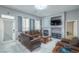 Living room with cozy seating, a fireplace, and a view to the front door at 7537 Splashing Rock Dr, Las Vegas, NV 89131