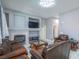 A cozy living room with a fireplace and leather furniture at 7537 Splashing Rock Dr, Las Vegas, NV 89131