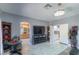 Open concept main bedroom with attached bathroom, walk-in closet, and white tile flooring at 7537 Splashing Rock Dr, Las Vegas, NV 89131