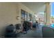 Covered patio area with outdoor seating and glimpses of the pool beyond at 7537 Splashing Rock Dr, Las Vegas, NV 89131