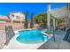 Backyard featuring a sparkling swimming pool with a safety fence at 7537 Splashing Rock Dr, Las Vegas, NV 89131