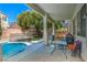 Backyard with a covered patio and refreshing pool at 7537 Splashing Rock Dr, Las Vegas, NV 89131