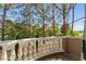 Balcony overlooking lush green trees with golf course in the background on a clear sunny day at 8215 Crow Valley Ln, Las Vegas, NV 89113