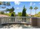This is a balcony overlooking lush trees and landscape on a clear sunny day at 8215 Crow Valley Ln, Las Vegas, NV 89113
