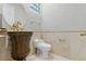 Bathroom featuring custom vanity, decorative mirrors, and gold fixtures at 8215 Crow Valley Ln, Las Vegas, NV 89113