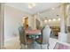 Elegant dining area showcasing views into the living room and spiral stairs at 8215 Crow Valley Ln, Las Vegas, NV 89113