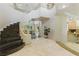 Grand entryway featuring a spiral staircase, tile flooring, and plenty of natural light at 8215 Crow Valley Ln, Las Vegas, NV 89113
