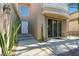 Charming front entrance with cacti, white door and covered porch at 8215 Crow Valley Ln, Las Vegas, NV 89113