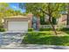 Charming two-story home showcasing a well-manicured lawn and an attached two-car garage at 8215 Crow Valley Ln, Las Vegas, NV 89113