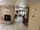 Welcoming entryway featuring tile flooring, a fireplace, and an open view to the dining and living areas at 8225 Bermuda Beach Dr, Las Vegas, NV 89128
