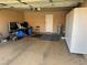 Functional garage space with additional storage cabinets and ample open area for vehicles at 8225 Bermuda Beach Dr, Las Vegas, NV 89128