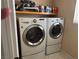 Well-equipped laundry room featuring side-by-side washer and dryer units at 8225 Bermuda Beach Dr, Las Vegas, NV 89128