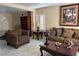Inviting living room with comfortable seating and tiled flooring for a cozy and low-maintenance space at 8225 Bermuda Beach Dr, Las Vegas, NV 89128