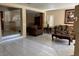 Comfortable living room with tiled floors, neutral walls, and open access to the front entrance at 8225 Bermuda Beach Dr, Las Vegas, NV 89128