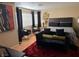 Main bedroom with ample natural light from windows and black curtains, creating a relaxing retreat at 8225 Bermuda Beach Dr, Las Vegas, NV 89128