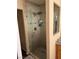 Shower with glass enclosure and tile surround, creating a clean and modern bathroom at 8225 Bermuda Beach Dr, Las Vegas, NV 89128
