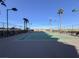 Well-maintained tennis court surrounded by lush greenery and desert landscape at 8255 Las Vegas Blvd # 1422, Las Vegas, NV 89123