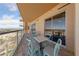 Condo balcony area with seating, privacy, and mountain views in the background at 8255 Las Vegas Blvd # 809, Las Vegas, NV 89123