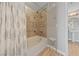Secondary bathroom showcasing tiled shower-tub combo with framed glass doors at 8255 Las Vegas Blvd # 809, Las Vegas, NV 89123