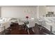 Bright dining area with a round glass table, modern chairs, and access to the breakfast bar and kitchen at 8255 Las Vegas Blvd # 809, Las Vegas, NV 89123
