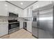 Modern kitchen featuring stainless steel appliances, white cabinetry, and stylish backsplash, ready for culinary adventures at 8255 Las Vegas Blvd # 809, Las Vegas, NV 89123