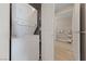 Neat laundry area with stacked washer and dryer and view into the bathroom at 8255 Las Vegas Blvd # 809, Las Vegas, NV 89123